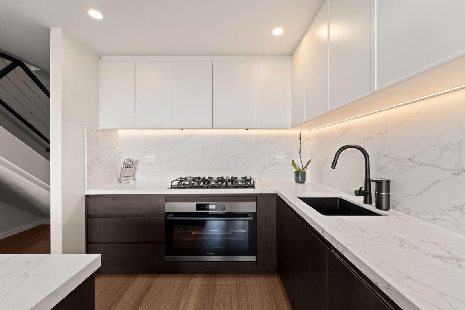 Dark Timber L-Shaped Kitchen - Coral Kitchen